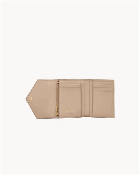 ysl monogram compact tri-fold wallet|CASSANDRE MATELASSÉ compact tri fold wallet in .